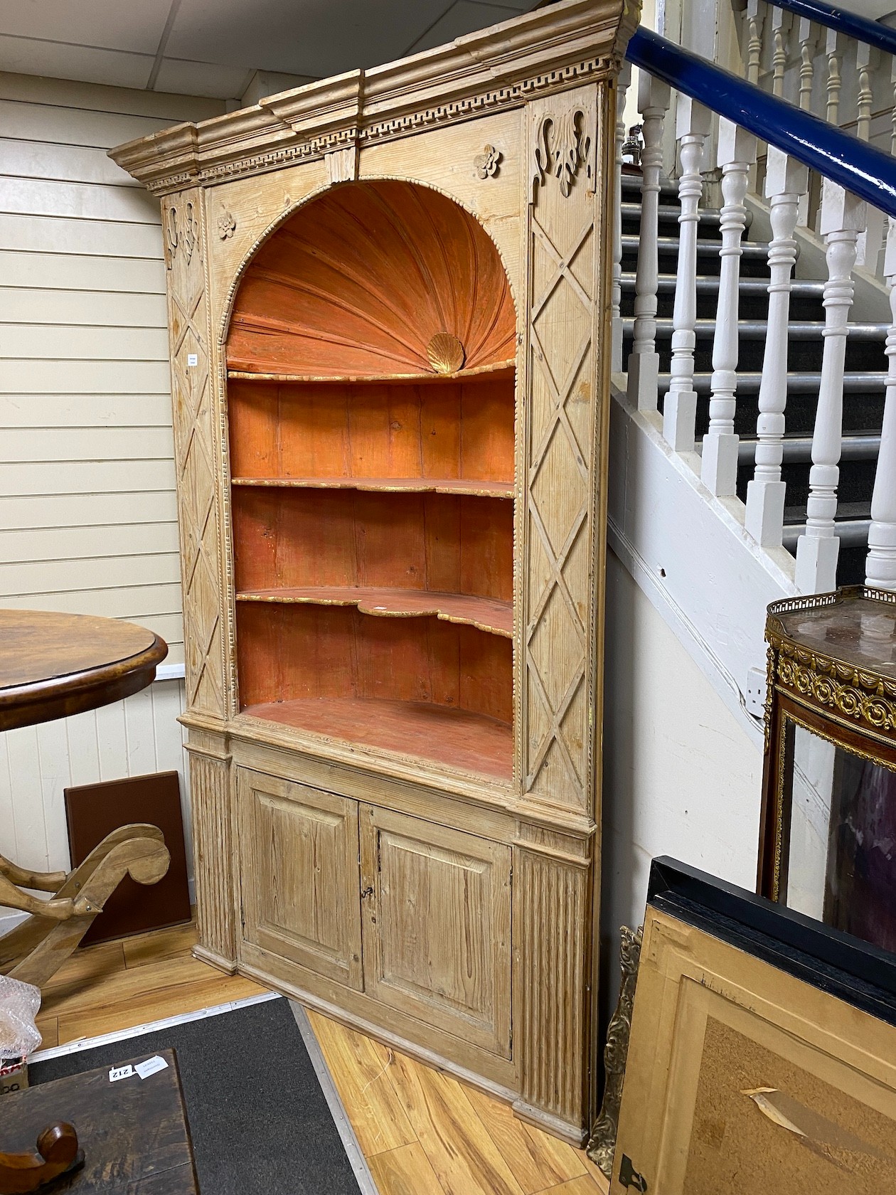 An early 18th century stripped pine alcove standing corner cupboard, width 154cm, depth 48cm, height 242cm